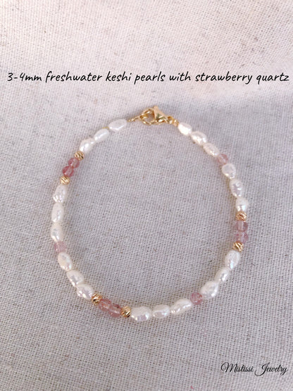 Bracelet with freshwater keshi pearls and strawberry quartz on a light gray background
